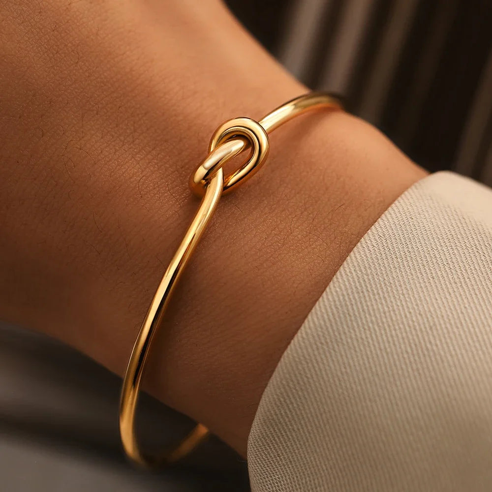 Connection Knot Cuff styled at the wrist
