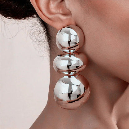 Sculpted Sphere Earrings — product and styling view 2