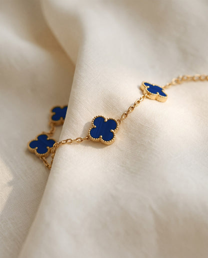 The Clover Bracelet in blue on ivory linen