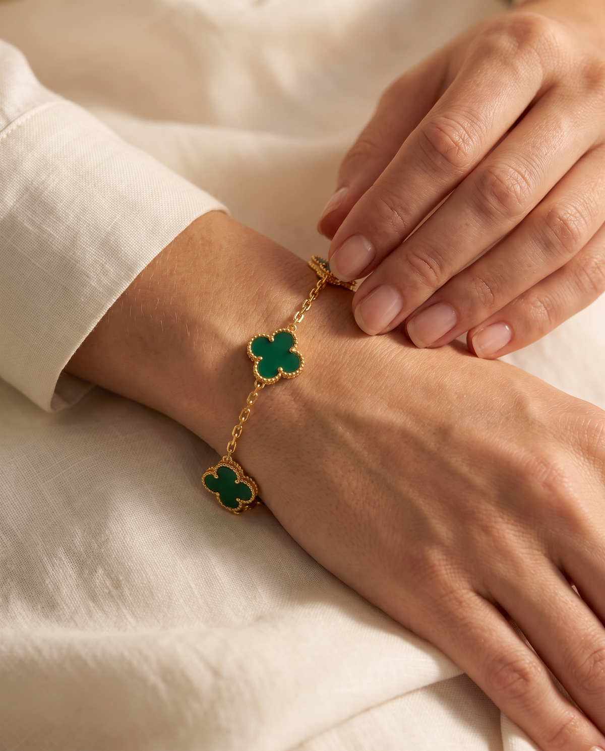 Green clover bracelet on the wrist