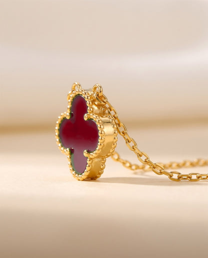 The Clover Necklace in red, close view of the pendant