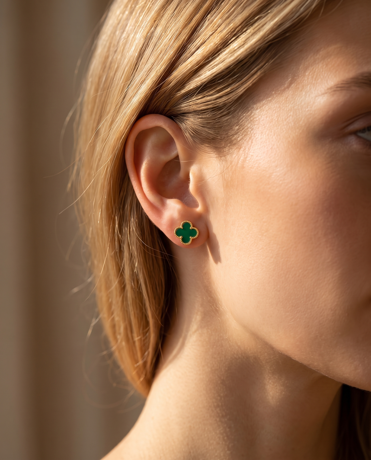Green clover stud earring worn